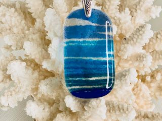 PENDANT "OCEAN" - Glass - Beautiful ocean colors - 1" x 2" - $65. Different colored glass is crushed to sand consistency then poured in layers into a frame, and fired to a temp of 1450F, in order to create the depth and layers of color.