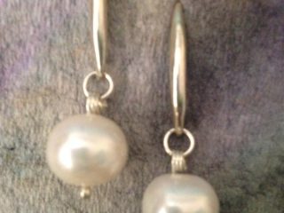 EARRINGS – Earrings in sterling silver with a white luster freshwater pearl - Pearl diameter .5” - Length 1.5” - Item #VM08 - $120