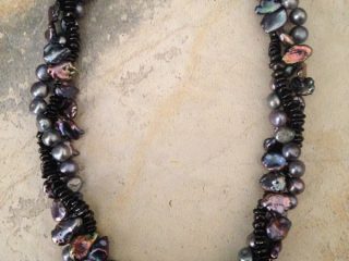 NECKLACE - Designed in a variety of freshwater pearls in shades of gray, black, & iridescent peacock blue - Sterling silver Toggle clasp - Length 17”- Item #VM12- $365