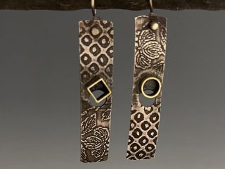 Catalog 4-15. Earrings -Sterling silver, with red brass accents and sterling silver ear wires Price: $105.